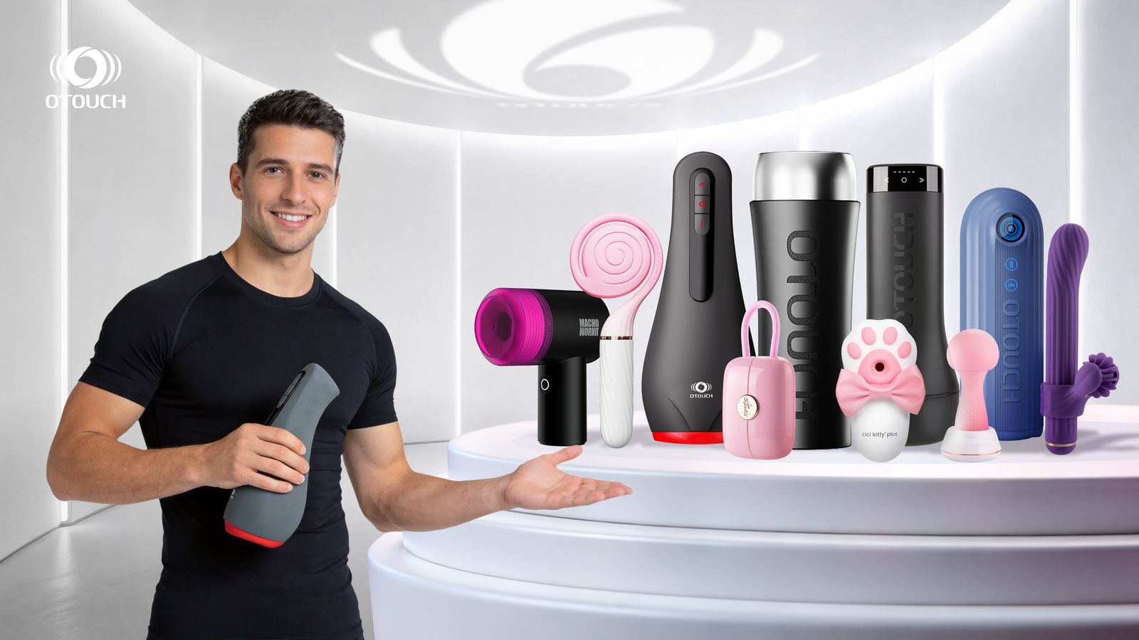 A smiling man in a black sports T-shirt holds a gray sex toy in his left hand and extends his right hand to the right. Behind him, on a white display stand, stands a series of OTOUCH brand sex toys. The background is a modern, futuristic white room.