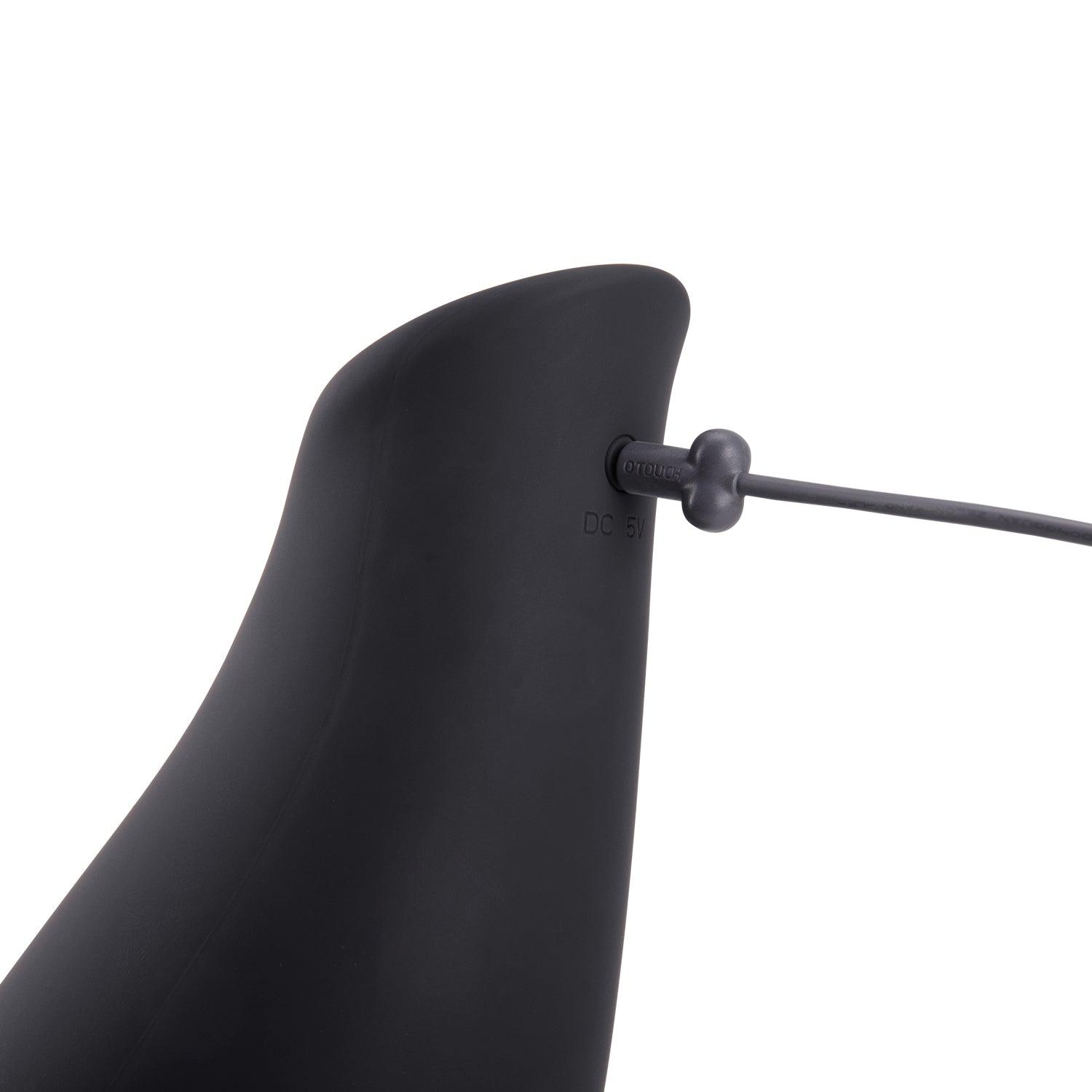 OTOUCH Pleasure Engine male masturbator USB charging port close-up showing magnetic pin connector on matte black silicone body