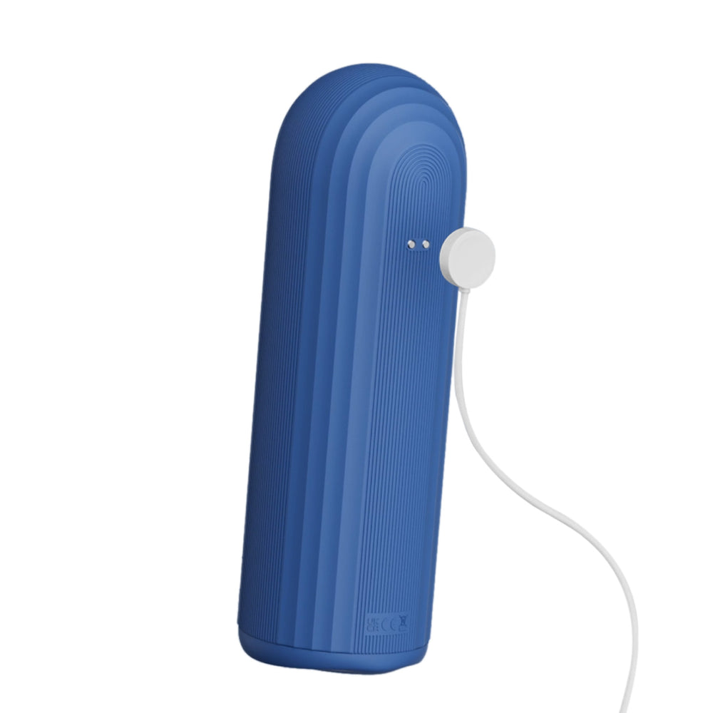 OTOUCH Submarine IPX7 waterproof masturbator back view showing magnetic wireless charging connector attached to blue silicone body