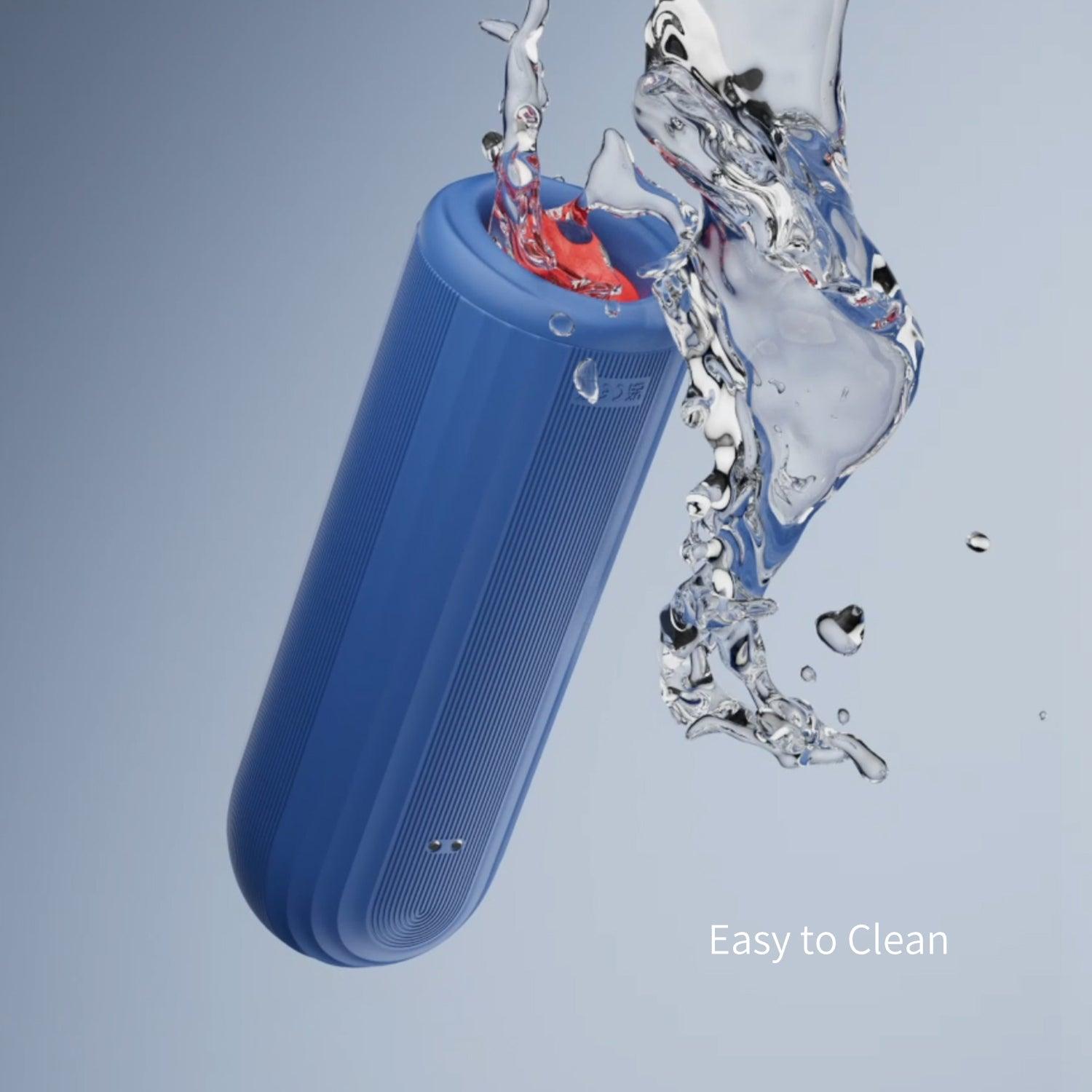 OTOUCH Submarine IPX7 waterproof male masturbator being rinsed with water splashing showing easy to clean waterproof silicone construction