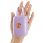 OTOUCH LOUIS vibrator lavender purple handbag design held in hand showing discreet luxury travel-ready size