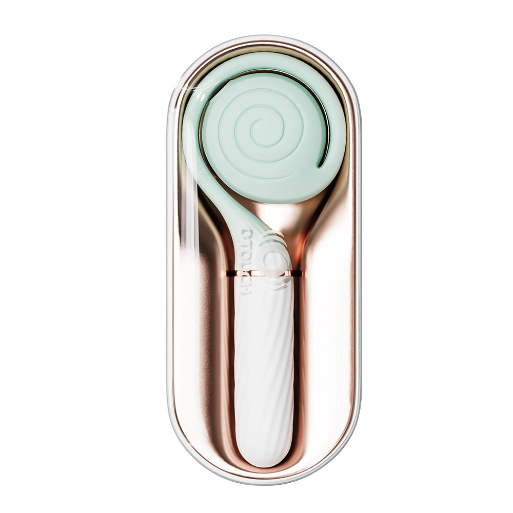 OTOUCH Lollipop mint green dual stimulation vibrator stored inside open rose gold luxury charging storage box showing compact travel-ready design