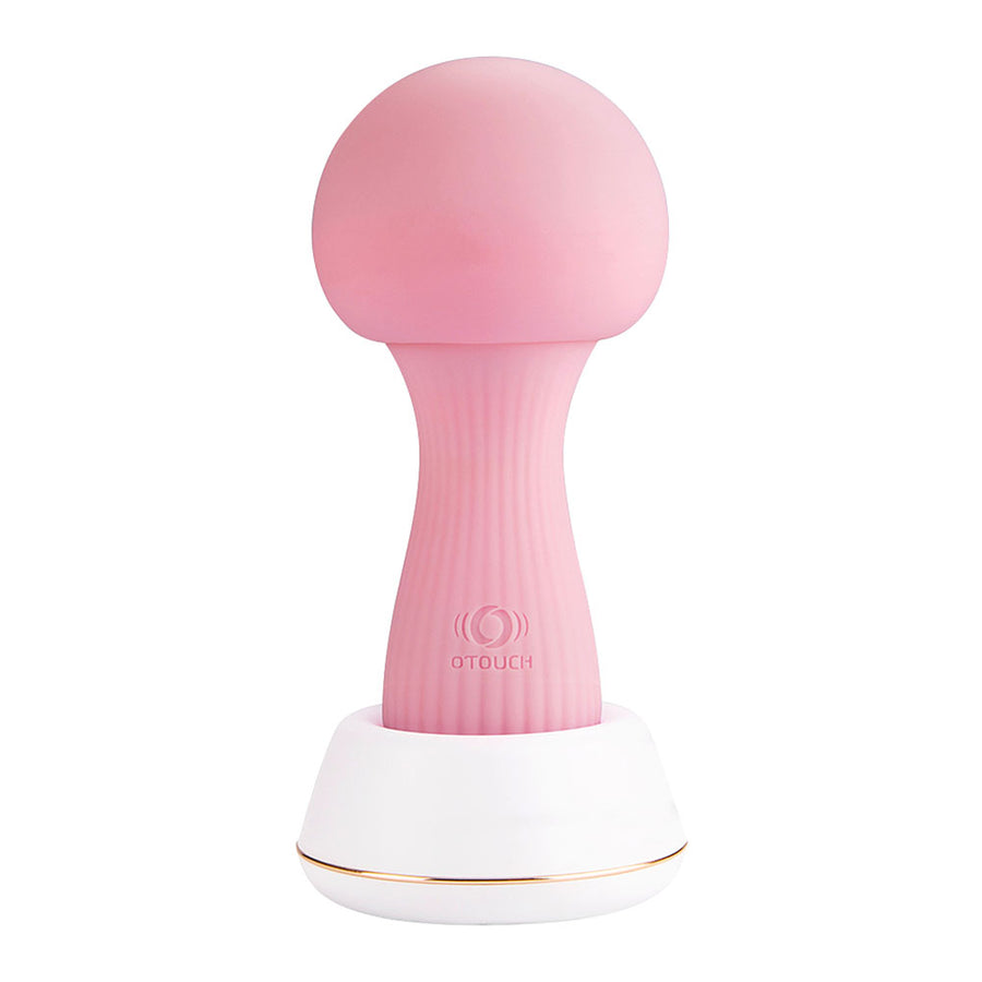 OTOUCH Mushroom Vibrator Pink on charging dock with mood light